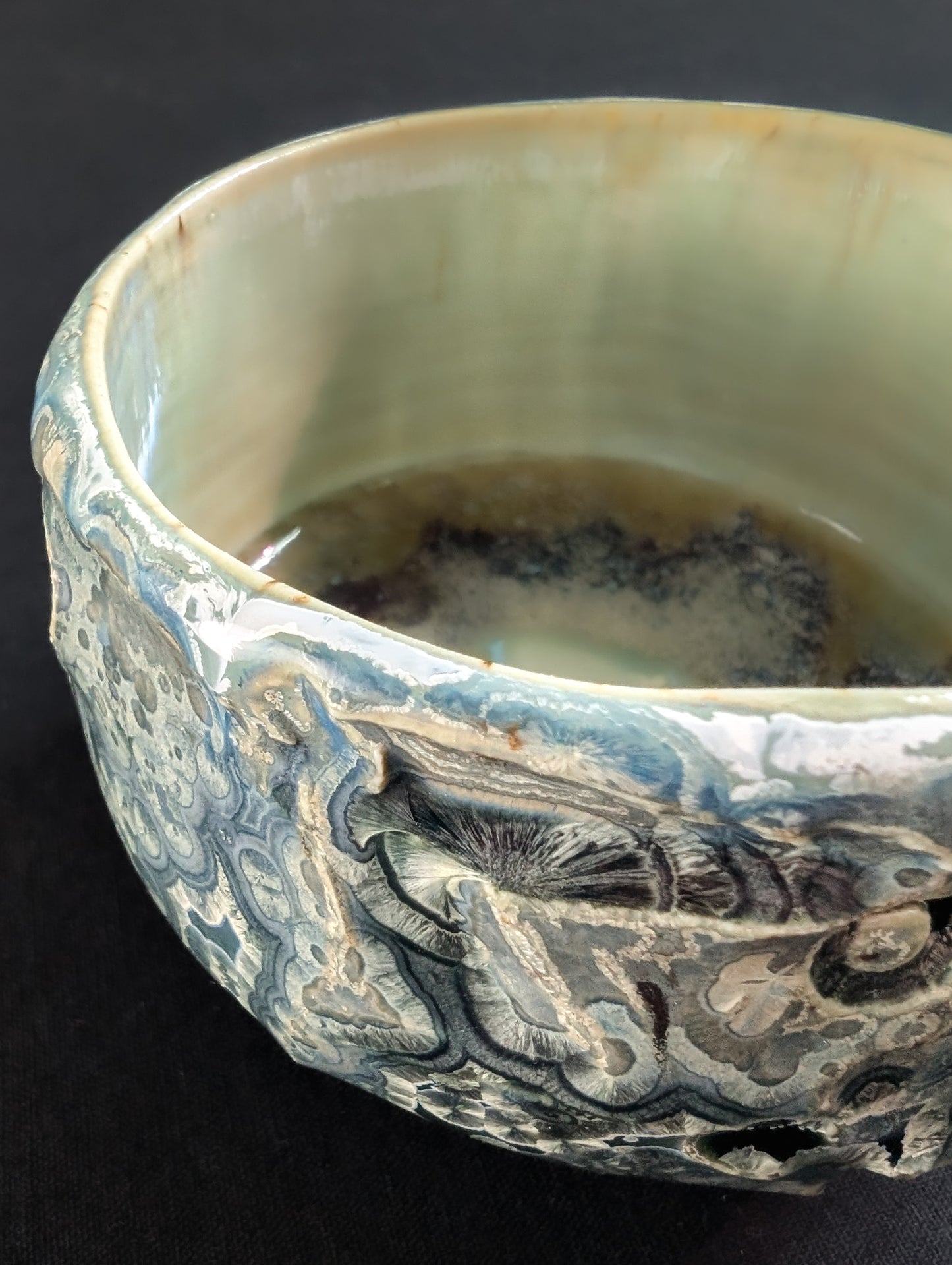 Texture detail of 'Tetsuya' tea bowl, revealing subtle depth, overcrystallized formations.