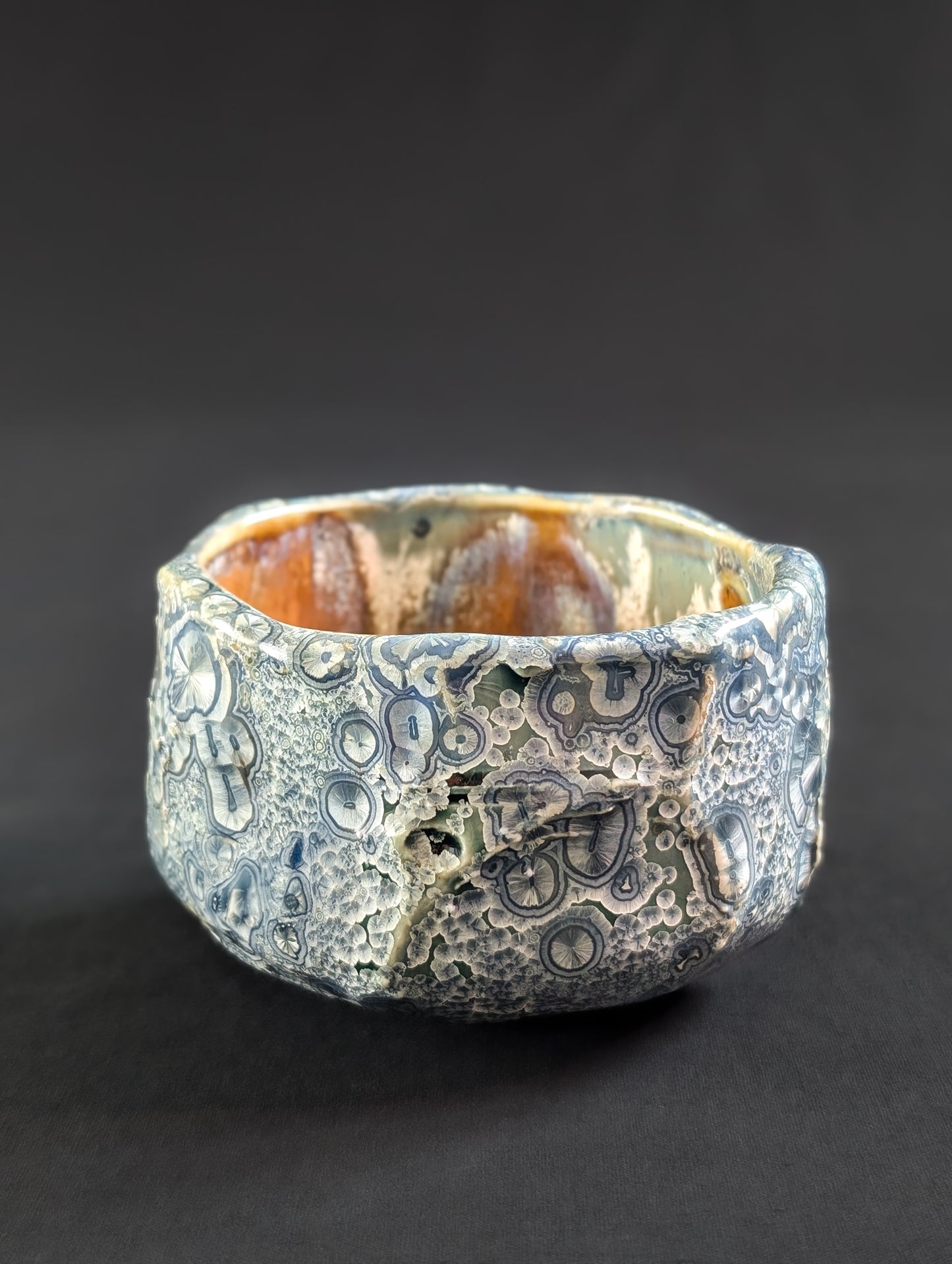 Textured ceramic Chawan on a black background