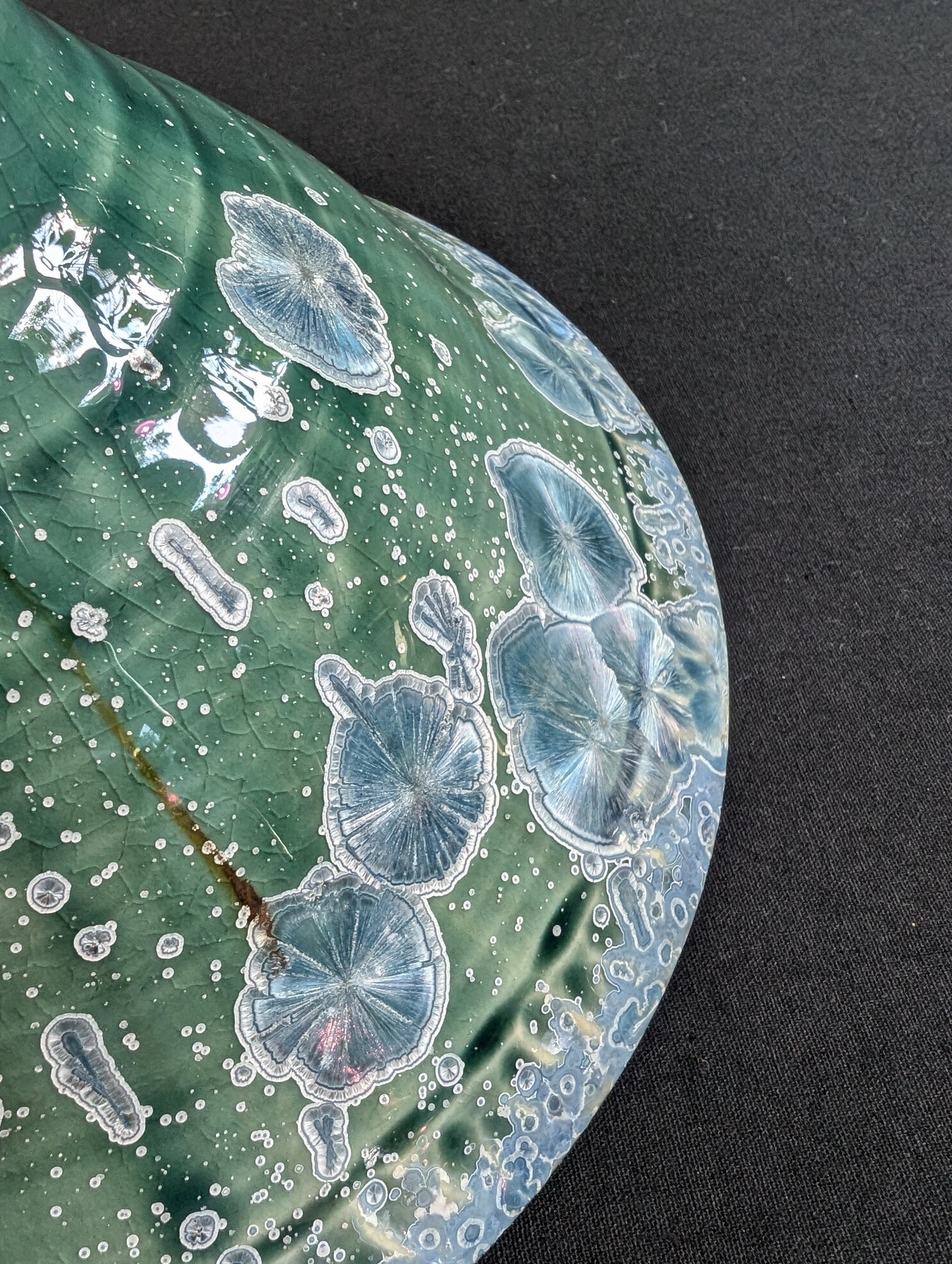 Close up view of the outside rim of crystalline ring dish by Robbin Harris.