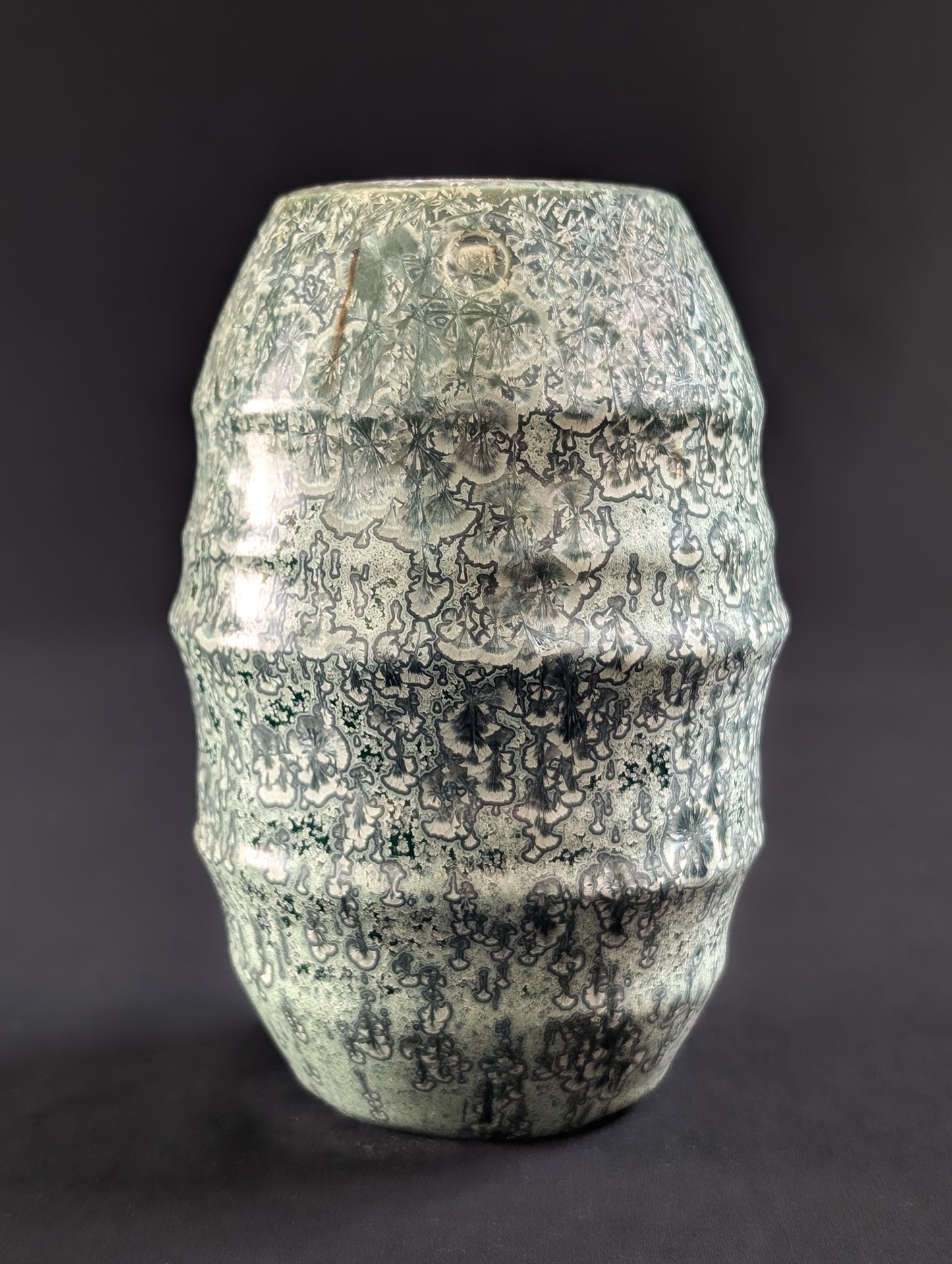 Unique green crystalline vase with silver crystal patterns and organic ribbed shape, handmade by Robbin Harris.