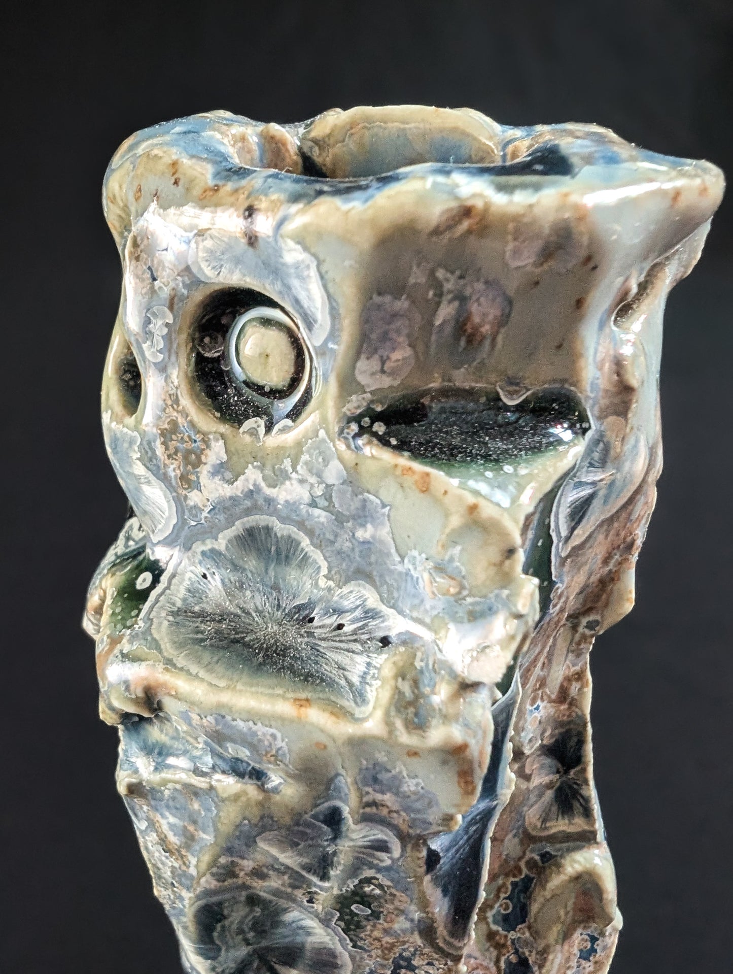 Close up of the top of Rock Bound, a ceramic vase designed as a tribute to Alberta's rugged wilderness.