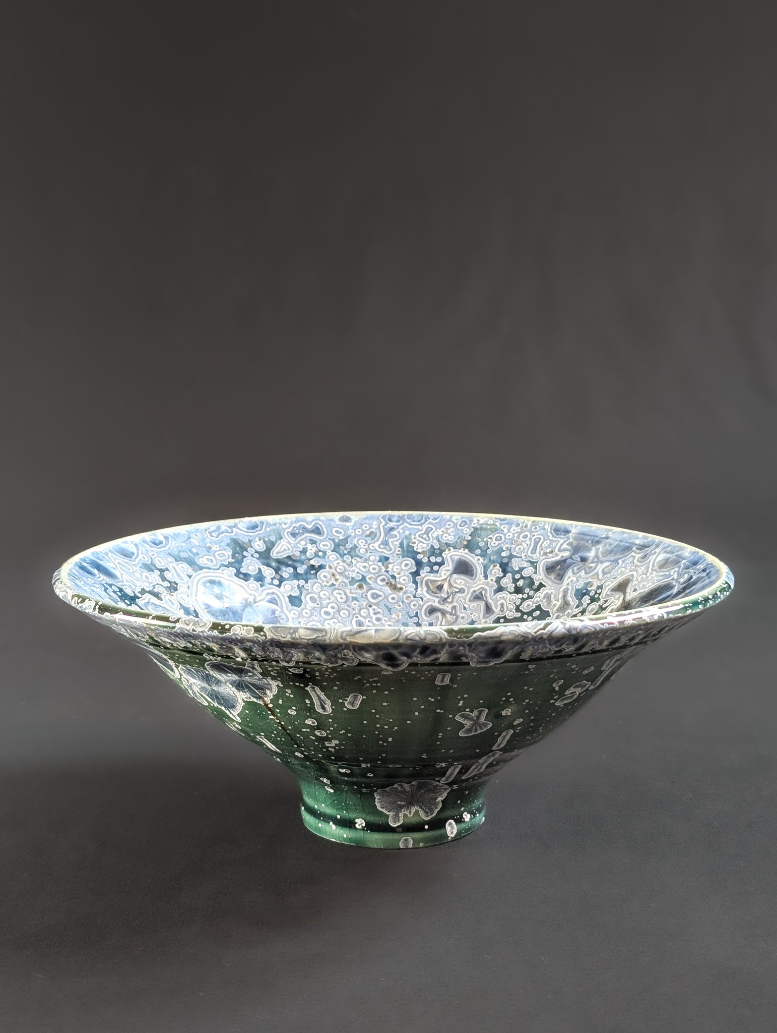 Front view of emerald green crystalline bowl with sapphire blue crystals.
