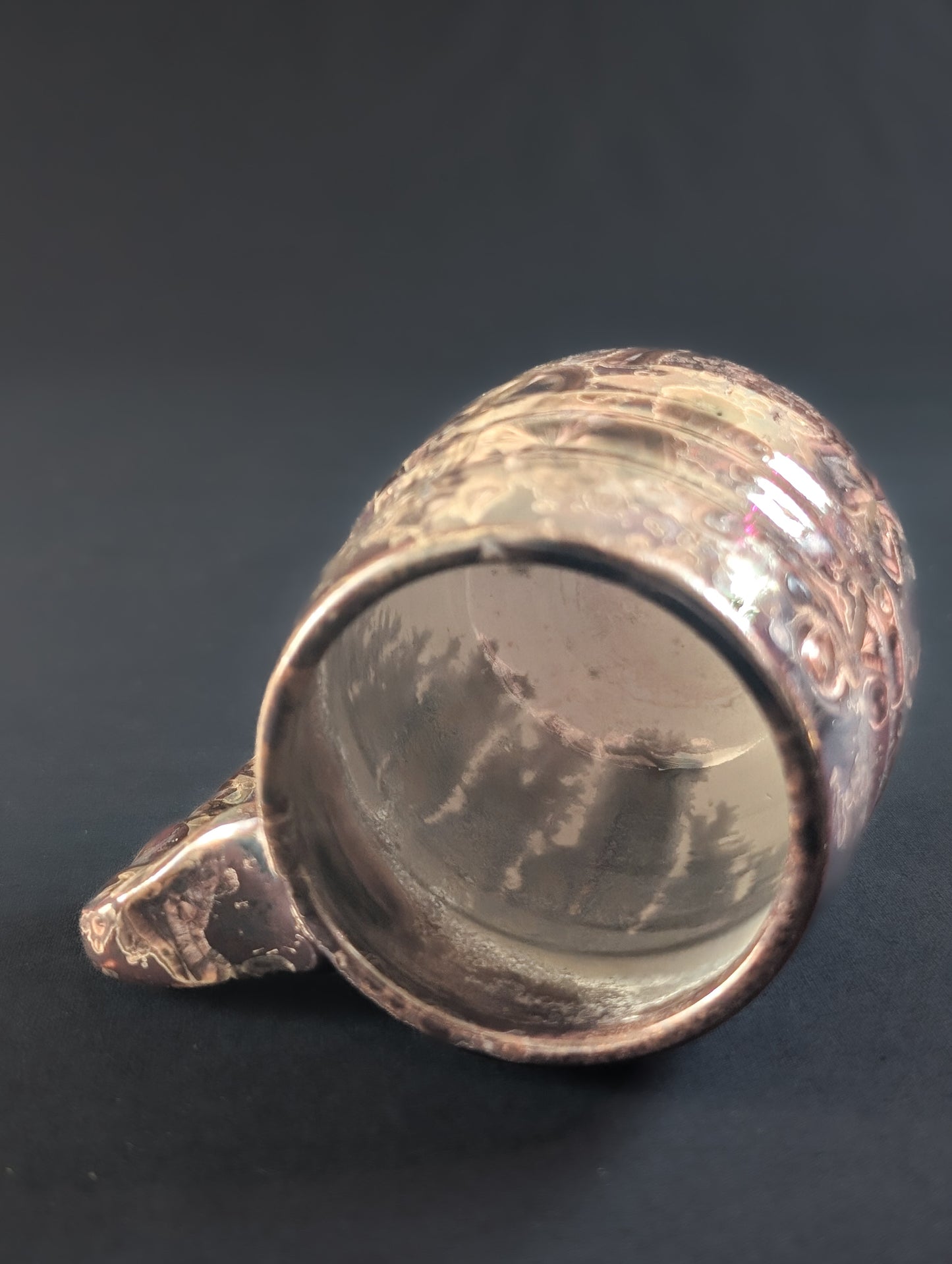 Inside view of porcelain reduction fired mug "Ember' showing white liner glaze.