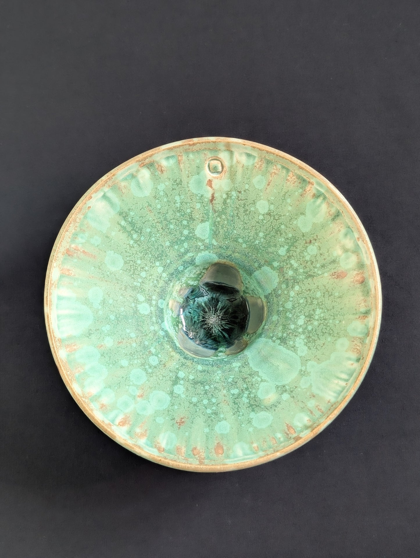 Top view of matte green crystalline ring dish by Robbin Harris.