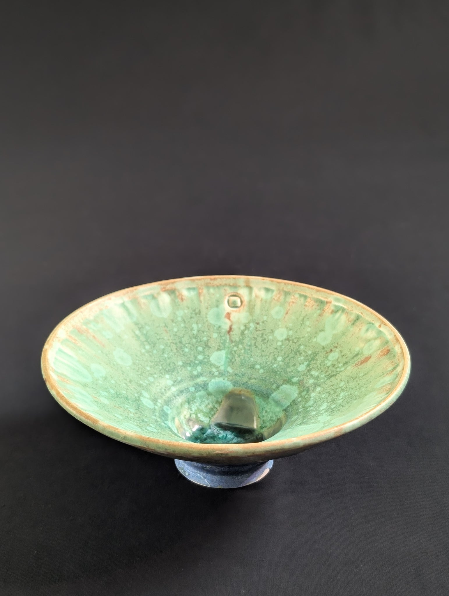 Angled view showcasing the tiny vibrant green crystals on the inside of this rare matte crystalline trinket dish.