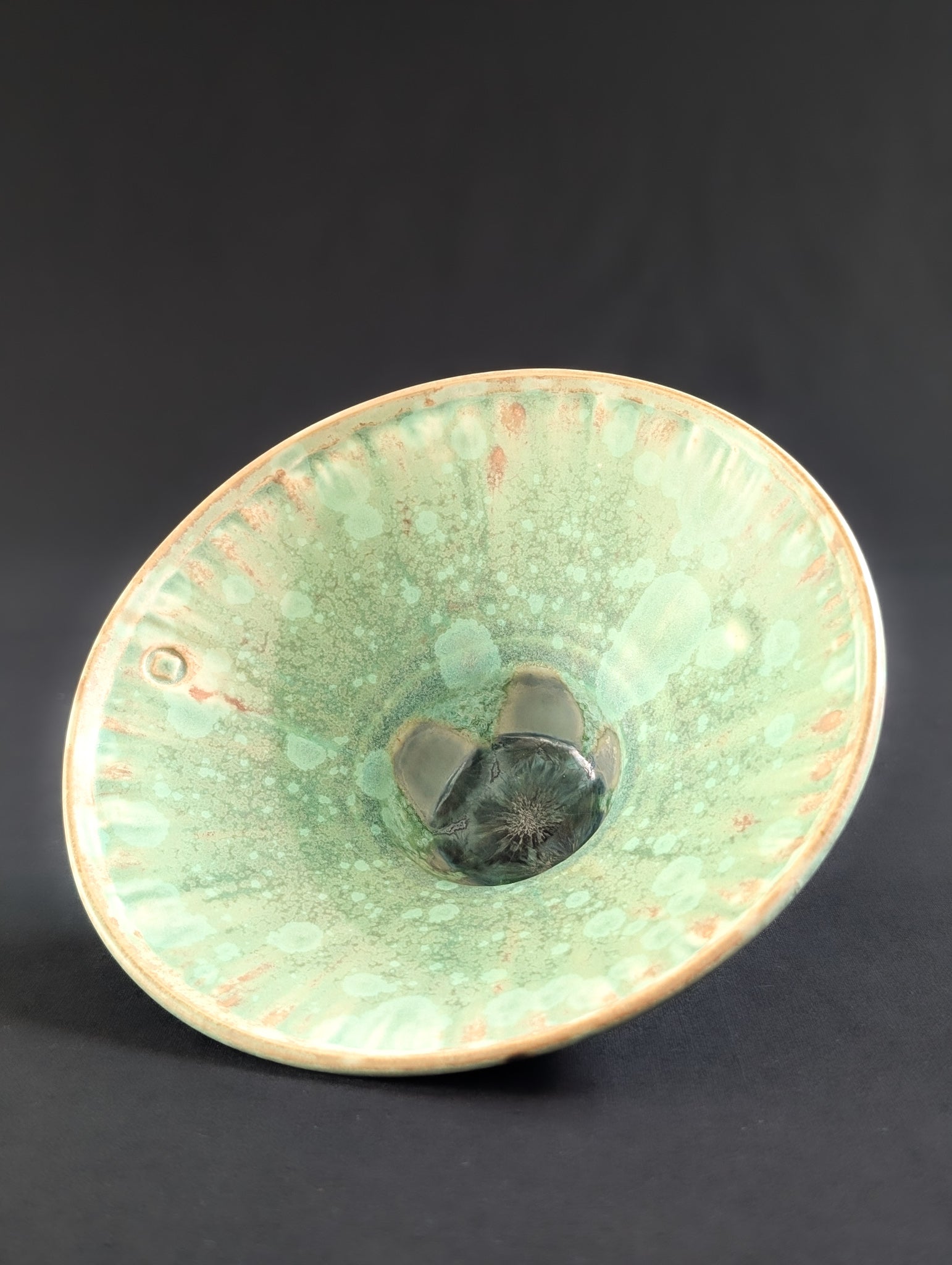 Front view of stunning crystalline patterns on a small green bowl by Robbin Harris.