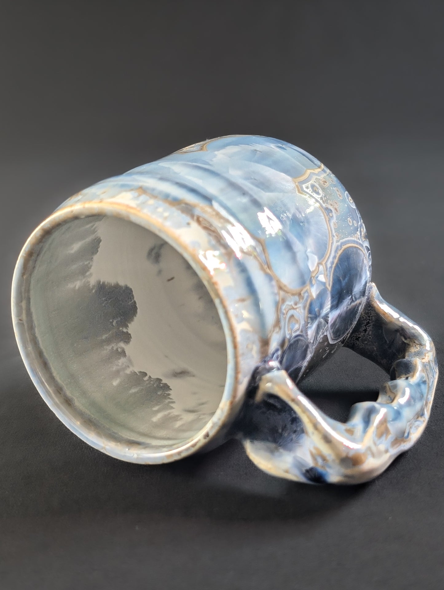 Top view of Skydust, revealing a smooth white interior liner glaze and thick, rounded lip — the crystals stop cleanly at the rim.