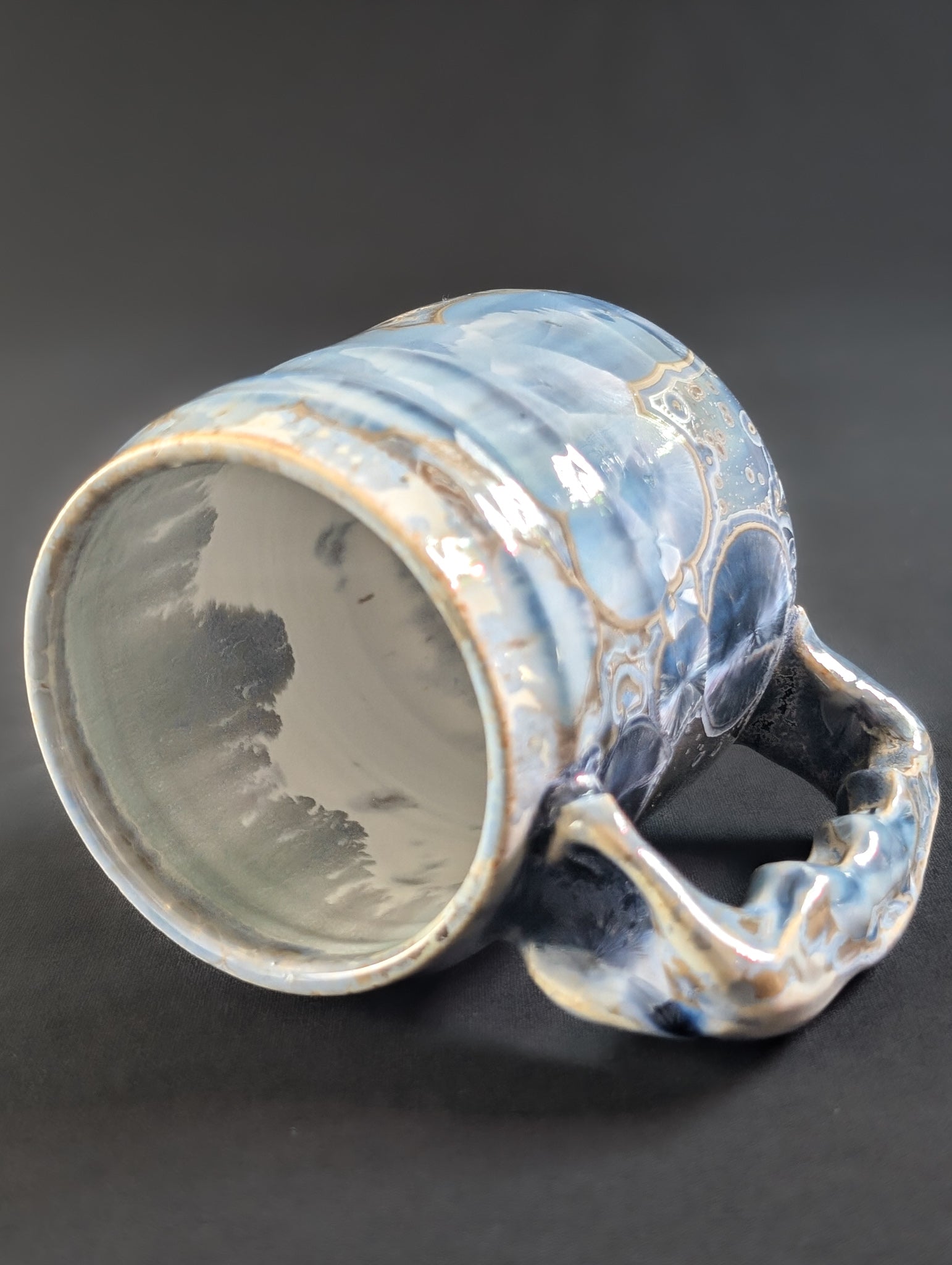 Top view of Skydust, revealing a smooth white interior liner glaze and thick, rounded lip — the crystals stop cleanly at the rim.