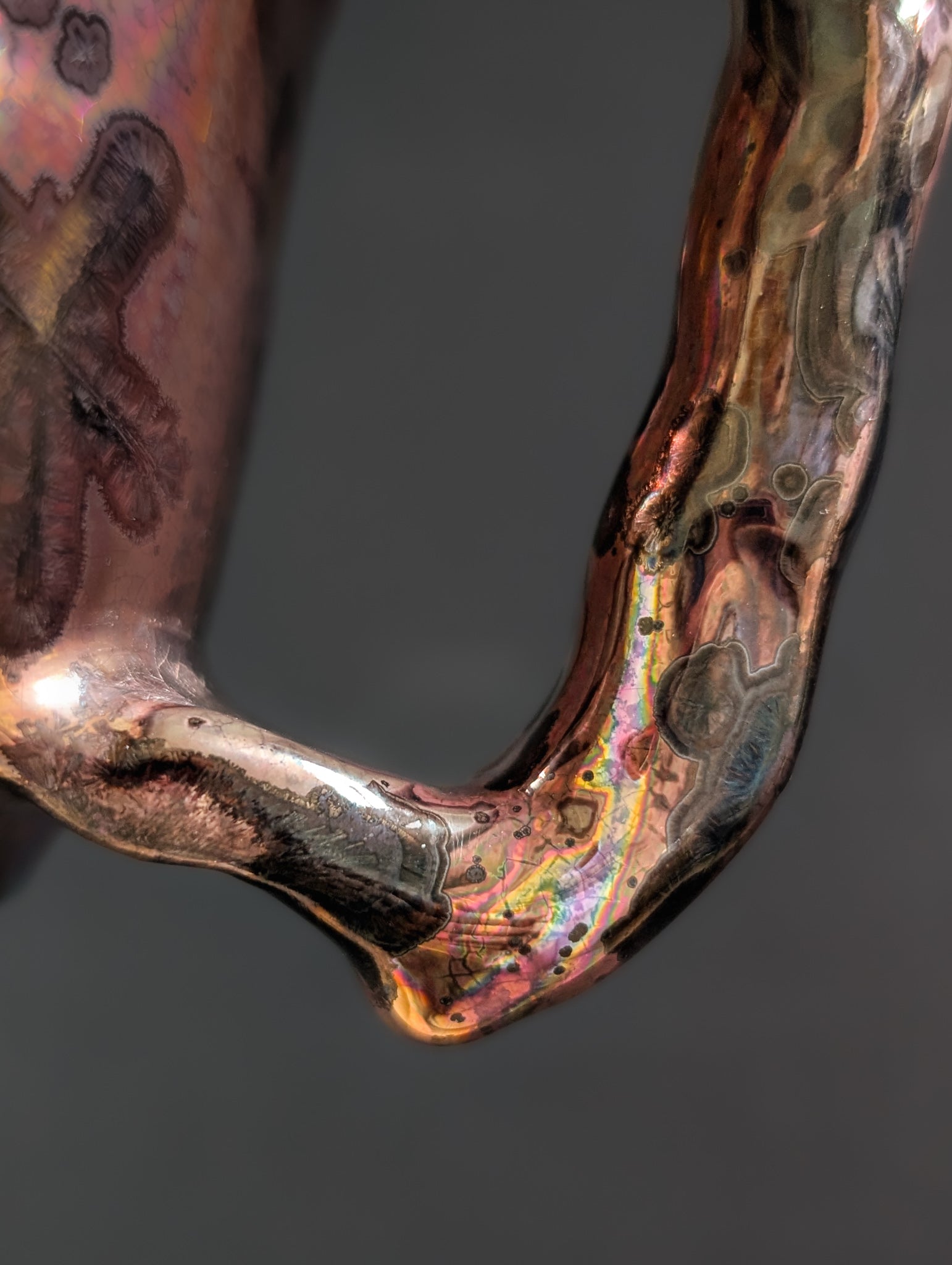 Close-up showing the molten, hammered-like handle of Pink Nebula.