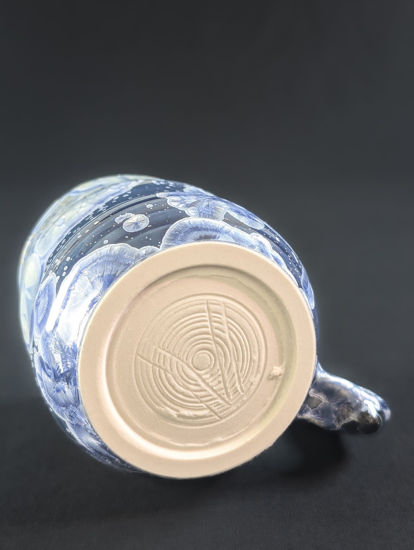 Base of Celestial Tides mug showing glaze flow and maker’s mark.