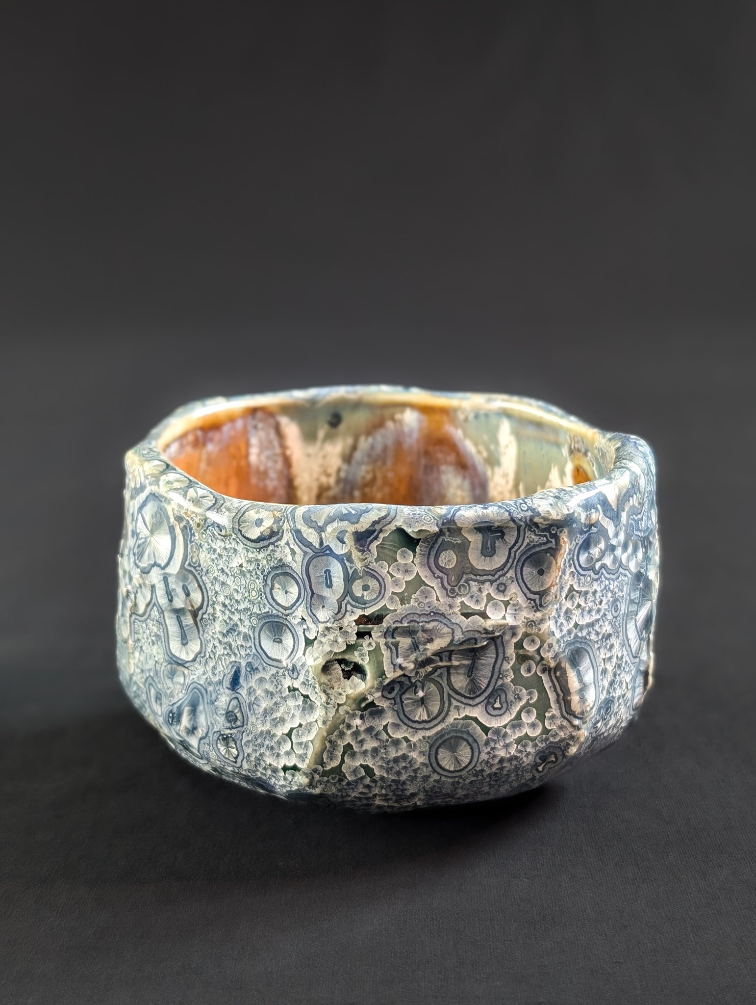 Textured ceramic Chawan on a black background