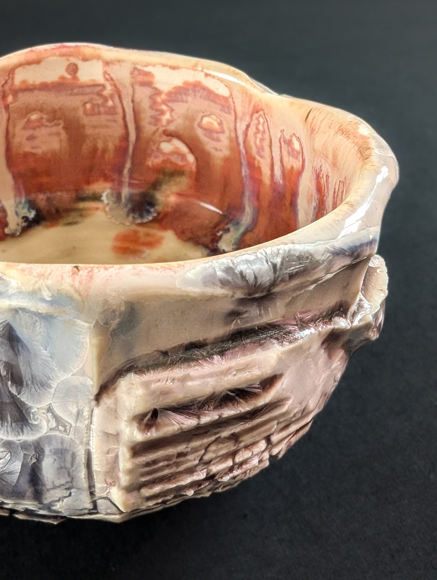 Close-up of 'Cliff Rose', revealing tiny, barely visible light pink crystals set into the glossy glaze.