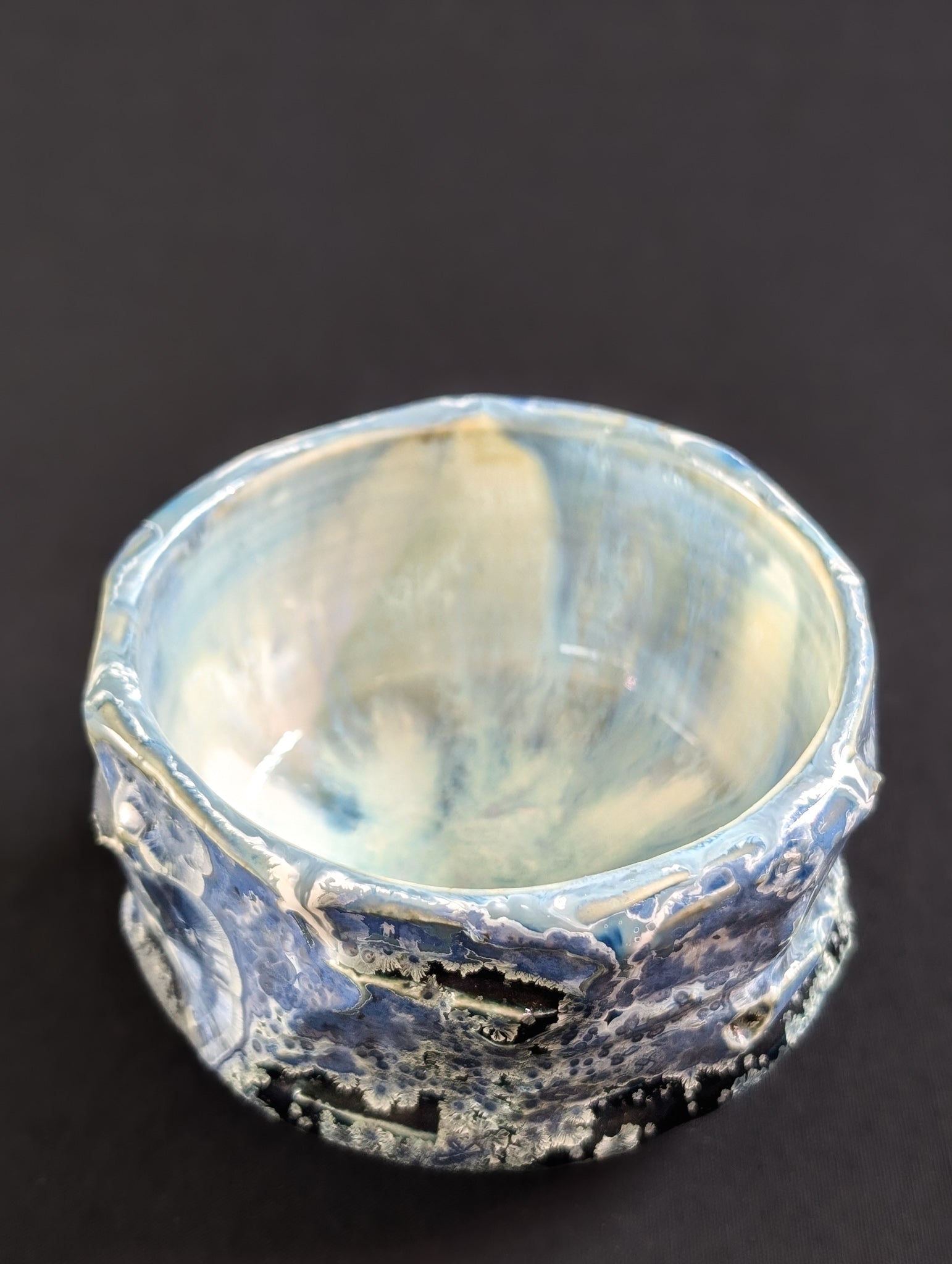 Top view of the 'Nightsky' chawan, showing the bowl's inner curve with a soft blue and creamy white glaze.