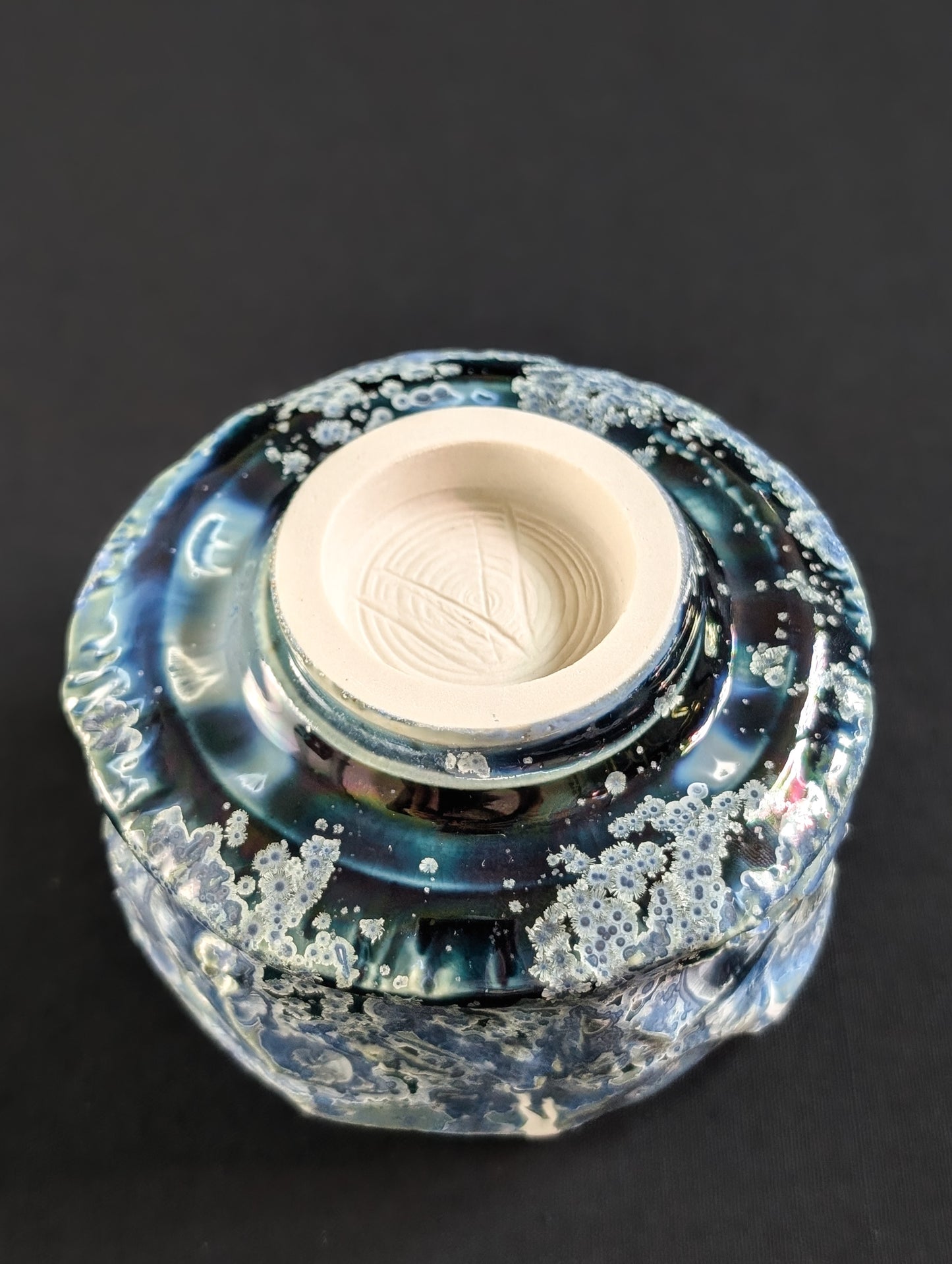 Underside of the 'Nightsky' chawan, showing unglazed foot with Robbin Harris’s carved 'V' maker's mark.

