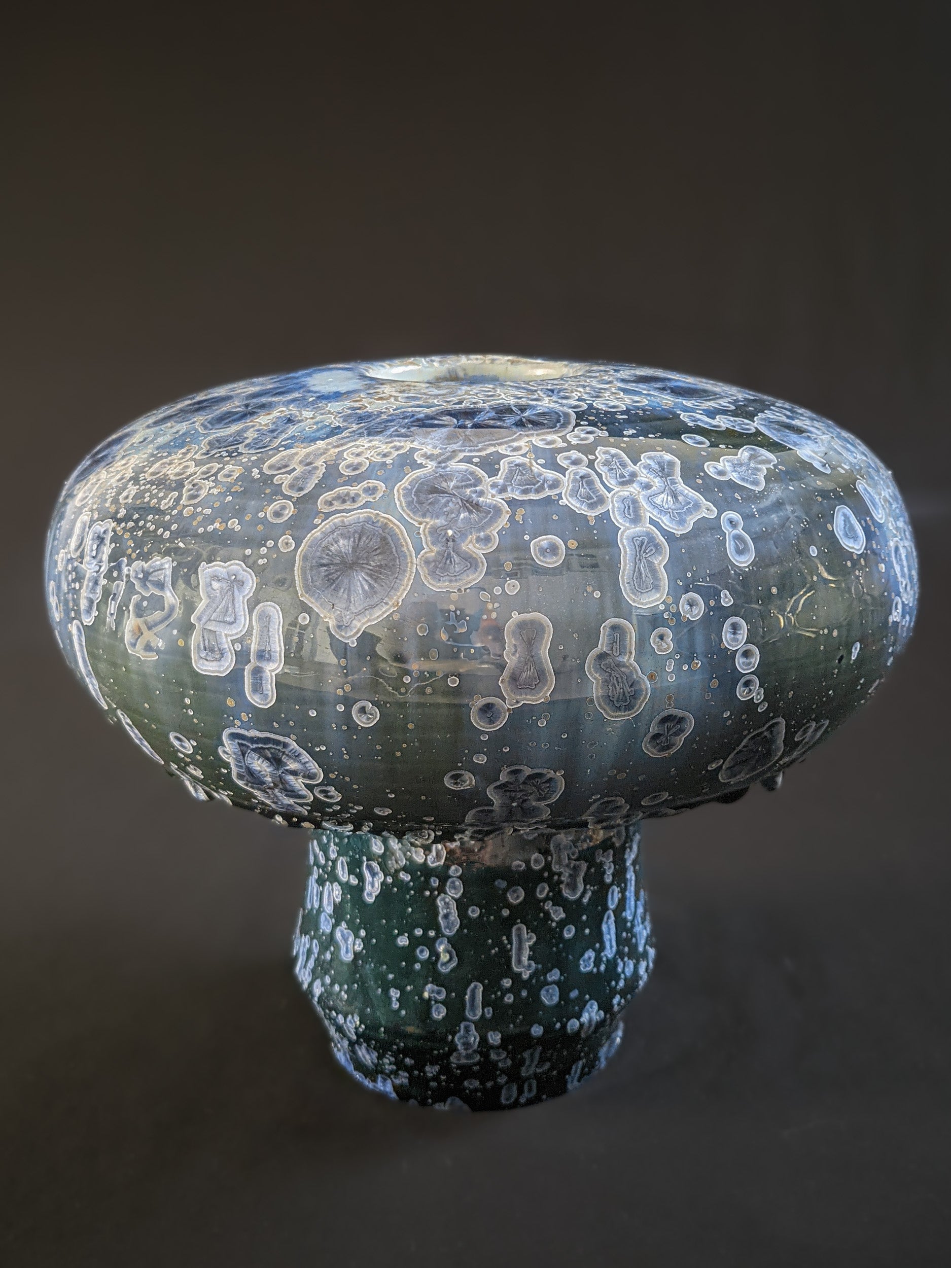 Front view of Majestic Verdance, showcasing its vibrant green crystalline glaze with intricate crystal formations.