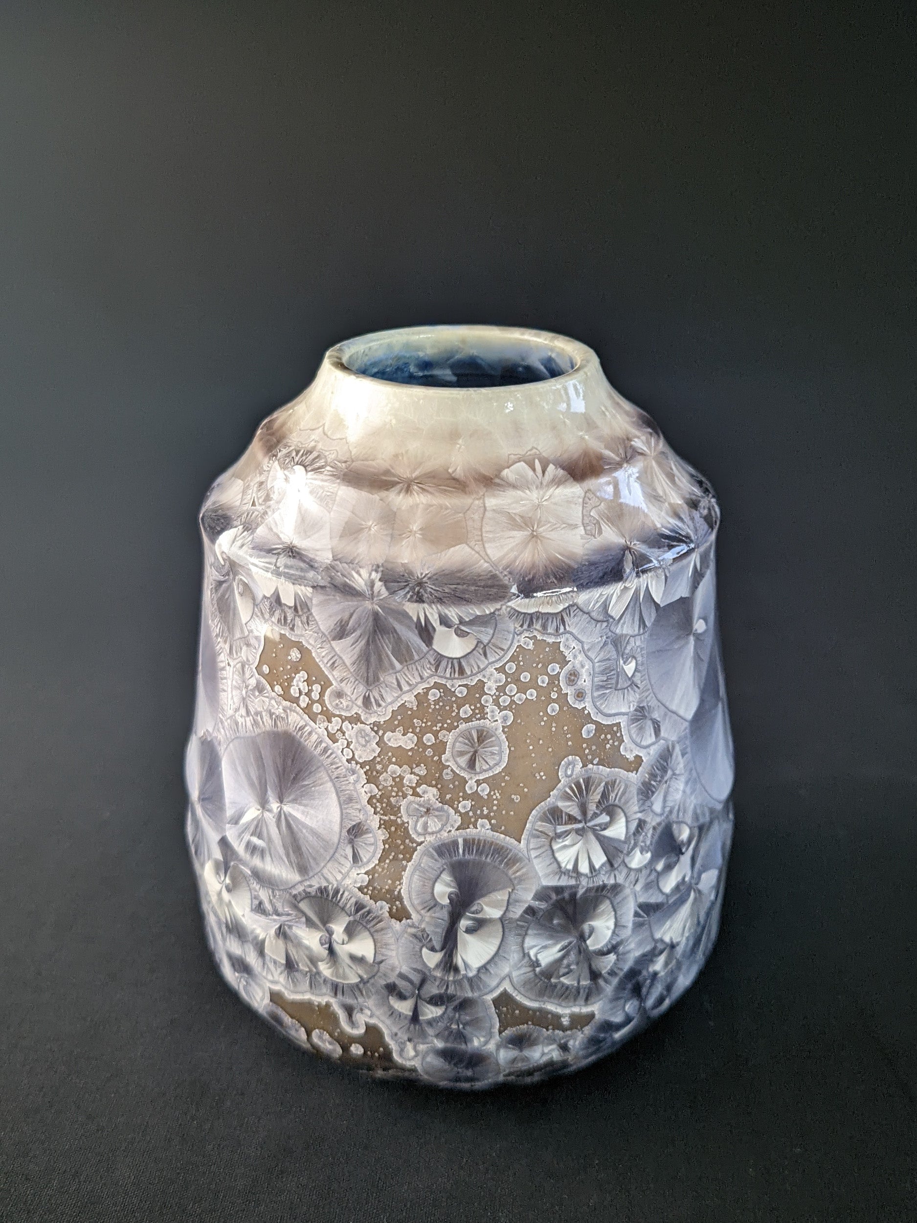 
Soft Dawn Vase featuring delicate pastel pink and cream tones with a smooth, glossy finish and a subtle organic shape, set against a dark backdrop
