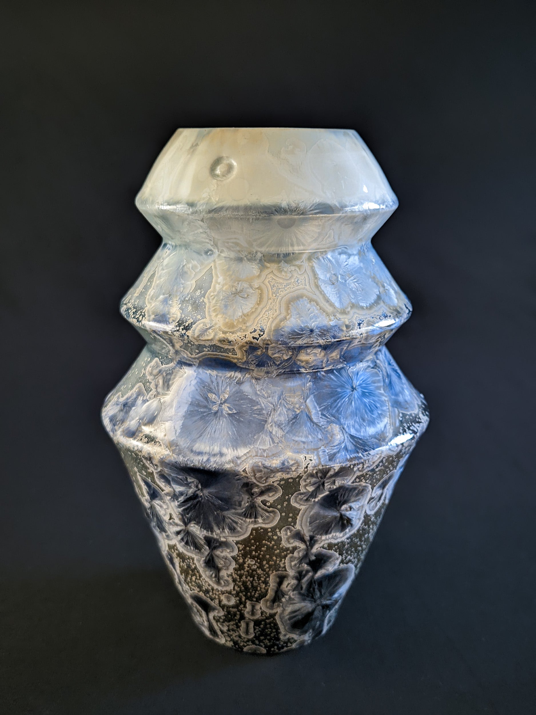 Frozen Serenity vase with a soft gradient from deep blue to light ivory, showcasing unique crystalline formations along its surface.