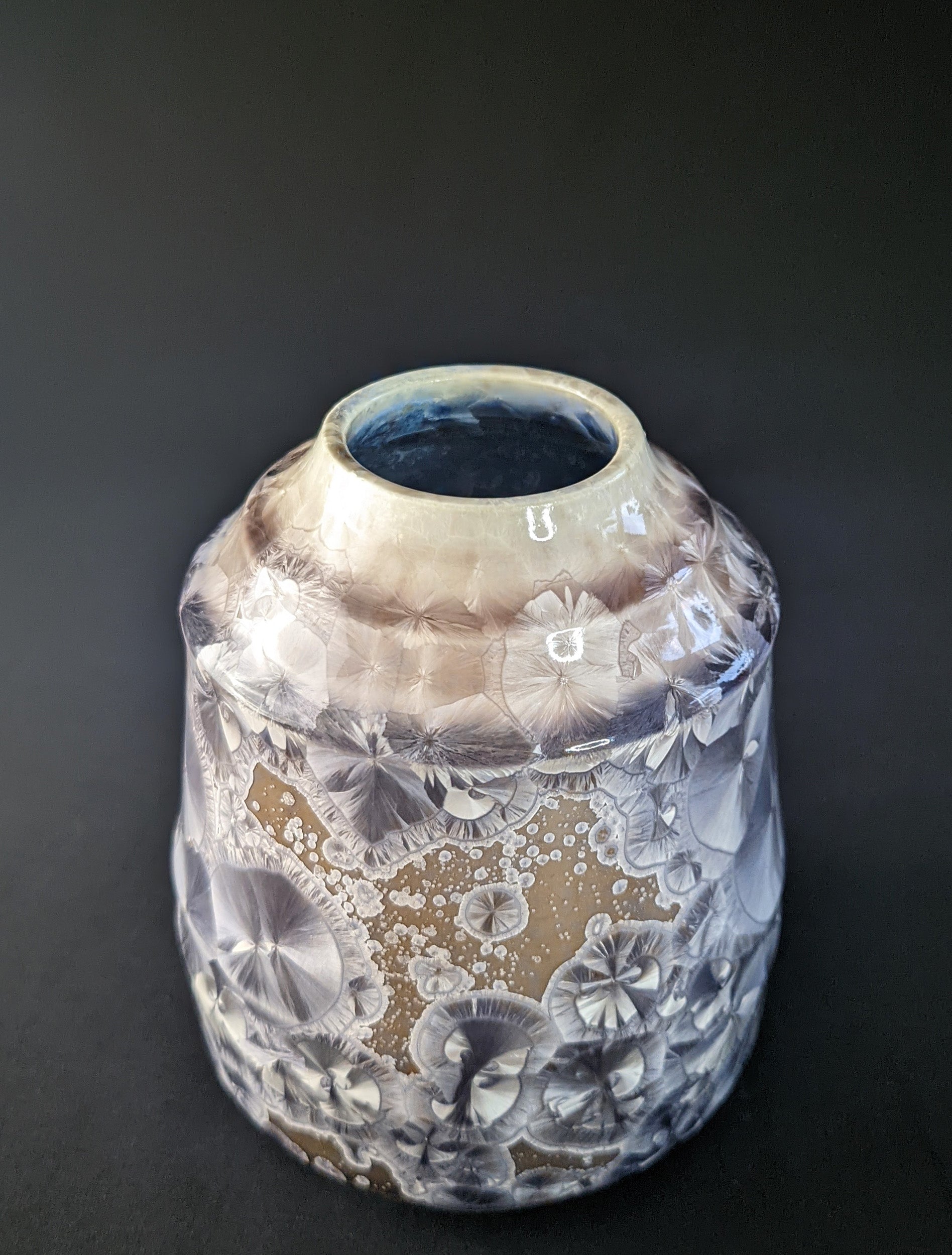 
Soft Dawn Vase featuring delicate pastel pink and cream tones with a smooth, glossy finish and a subtle organic shape, set against a dark backdrop
