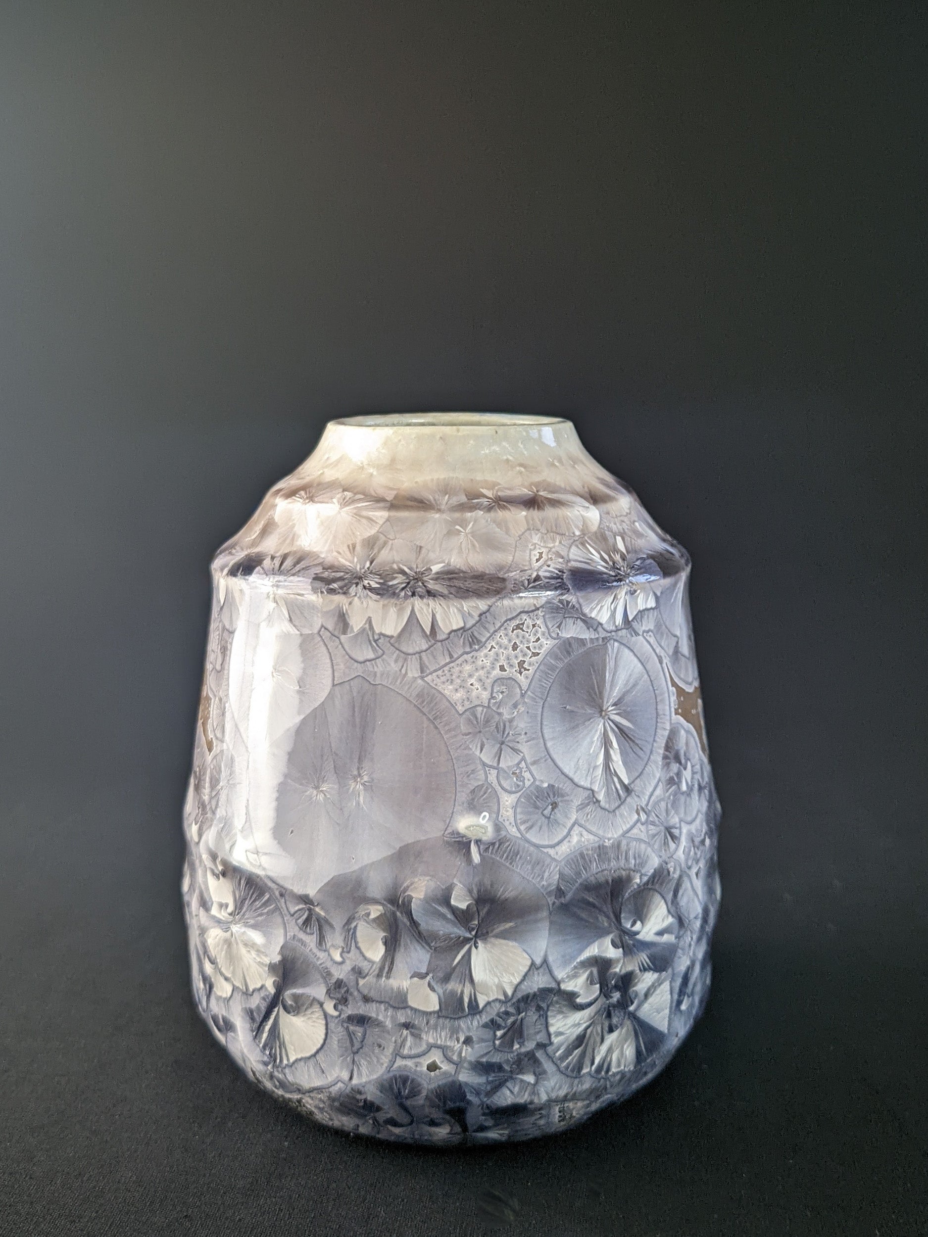 
Soft Dawn Vase featuring delicate pastel pink and cream tones with a smooth, glossy finish and a subtle organic shape, set against a dark backdrop
