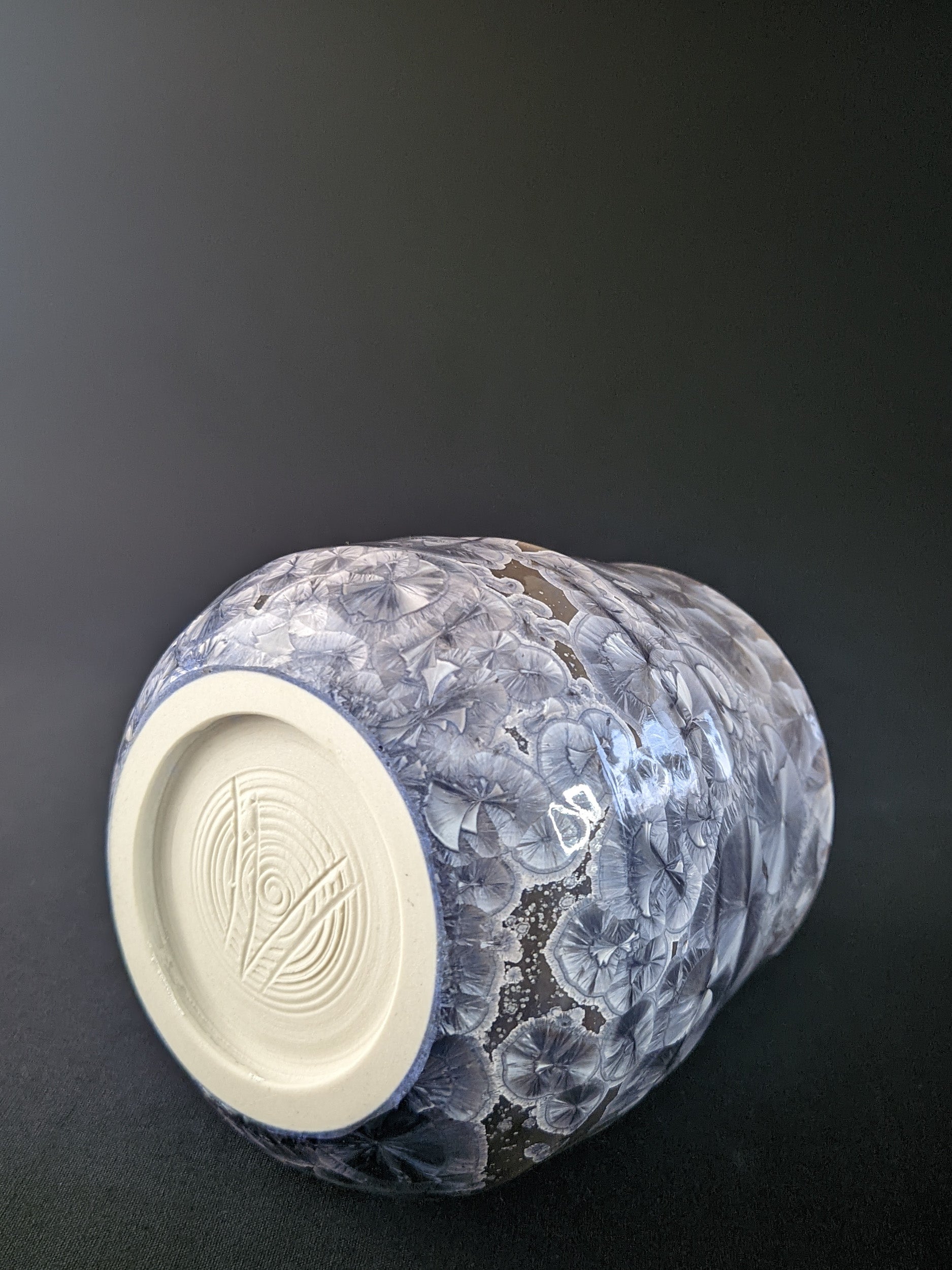 
Soft Dawn Vase featuring delicate pastel pink and cream tones with a smooth, glossy finish and a subtle organic shape, set against a dark backdrop
