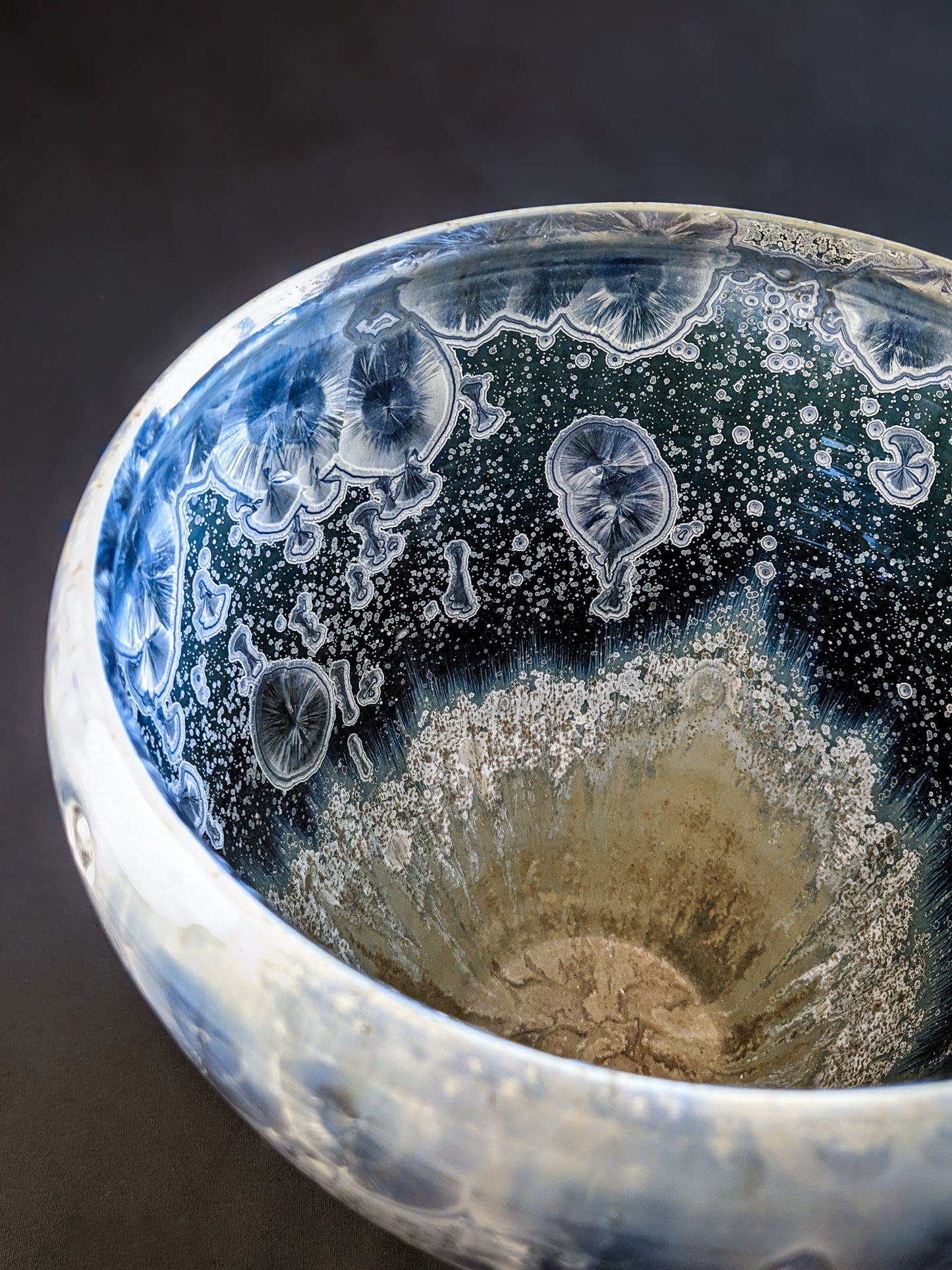  A top-down view of the vessel, revealing its wide opening and intricate crystal patterns inside, perfect for display or functional use.