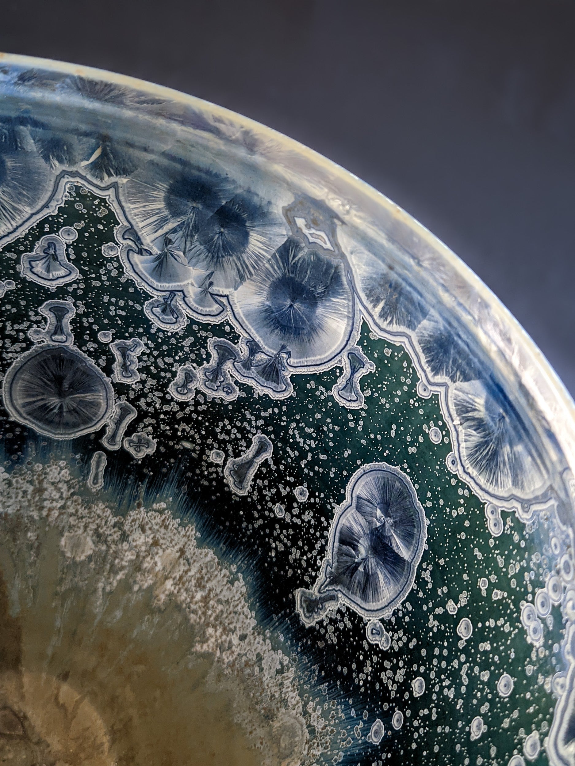 The interior of the sculptural vessel, featuring the same large blue crystals and secondary white formations, making it equally stunning inside and out.