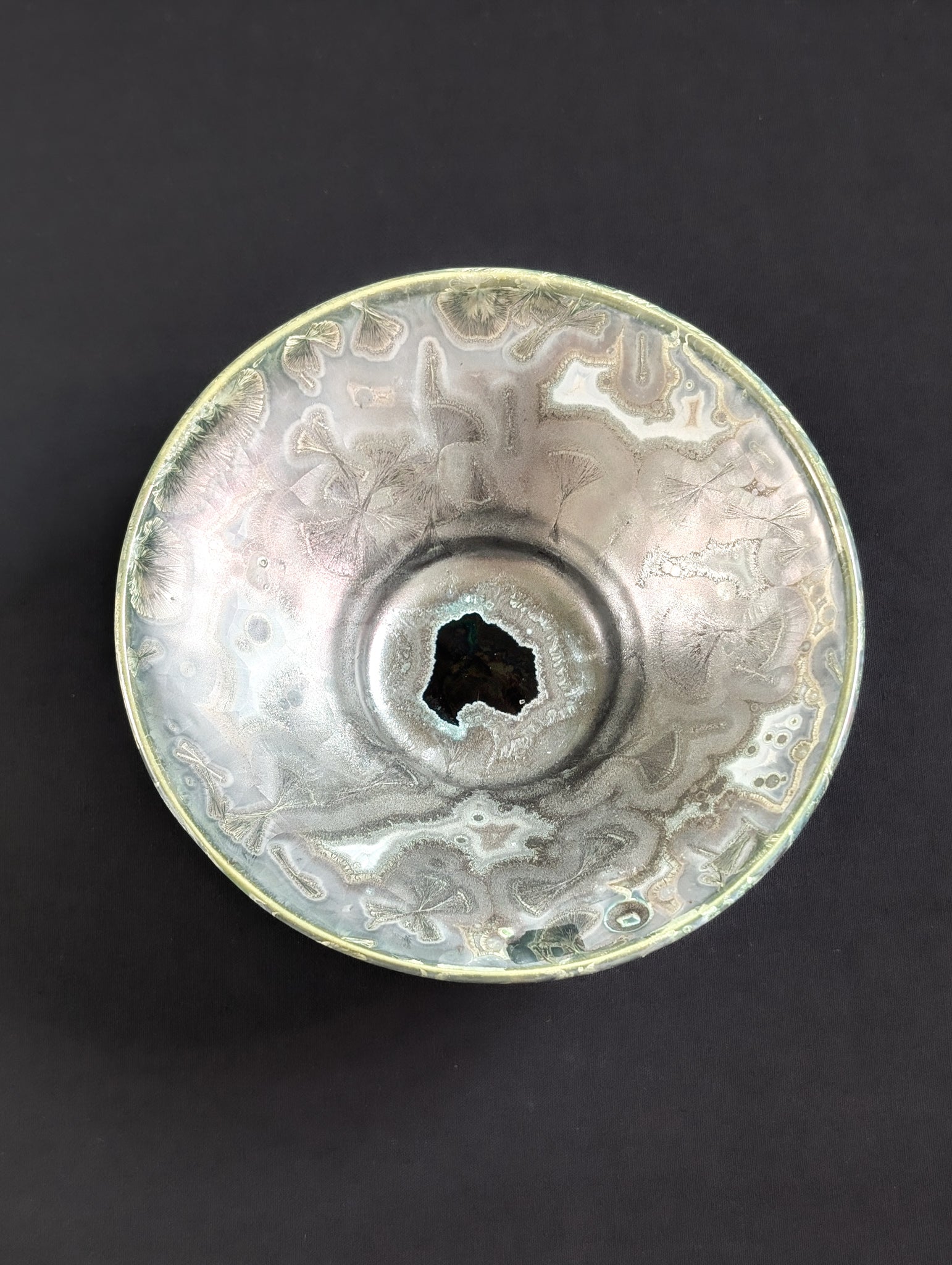 Top view of titanium colored inside of a porcelain trinket dish by ceramic artist Robbin Harris.